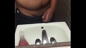 Thick 18 y/o jerks off in public bathroom