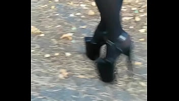 Lady L walking xtreme black high heels.