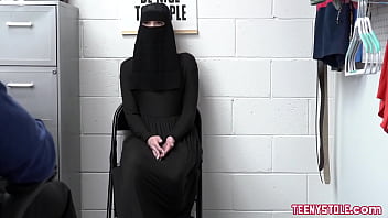 Security officer Justin Magnum brings Delilah Day to the back to confront her, when Delilah denies everything, officer Justin shows her footage of her piling expensive underwear under her hijab.